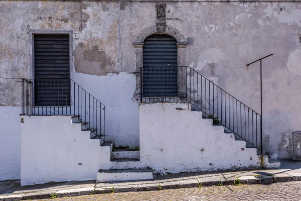 Doors and stairs. Scenic sight in Monte Sant\'Angelo, ancient village in the Province of Foggia, Apulia (Puglia), Italy.