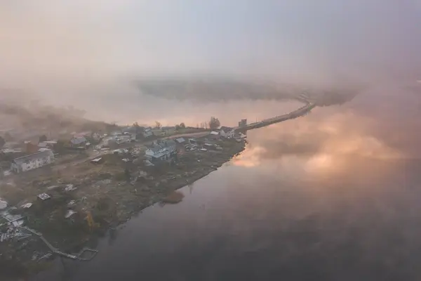 Aerial view of a coast of Ladoga Lake over the fog