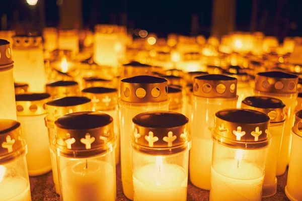 Many candles kindling at a cemetery on All Saints\' Day