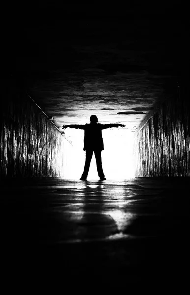 Silhouette of woman in a tunnel. — Stock Photo, Image