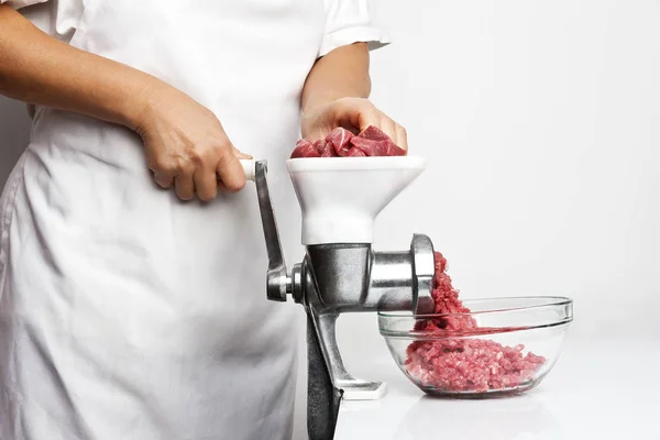 Getting minced using a meat grinder — Stock Photo, Image