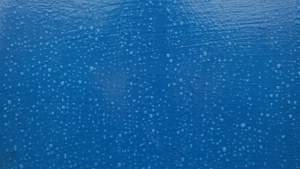 Background with a blue base and drops of water.