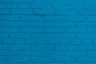 Tuğla duvar, maviye boyanmış. Arka plan, doku. Biçim ve tasarım.