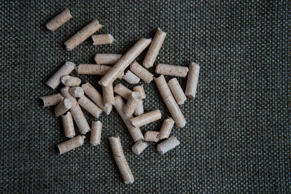 Close up. Pellets pellets lie on the burlap.
