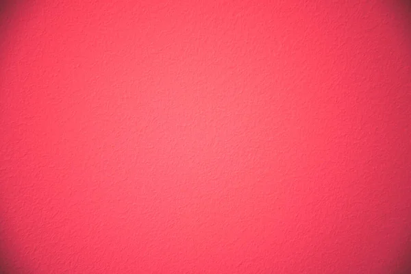Texture di una parete dipinta di rosso. Ricco colore rosso con vignettatura . — Foto Stock