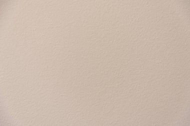Krem rengi duvar dokusu. Yakın plan, pastel.