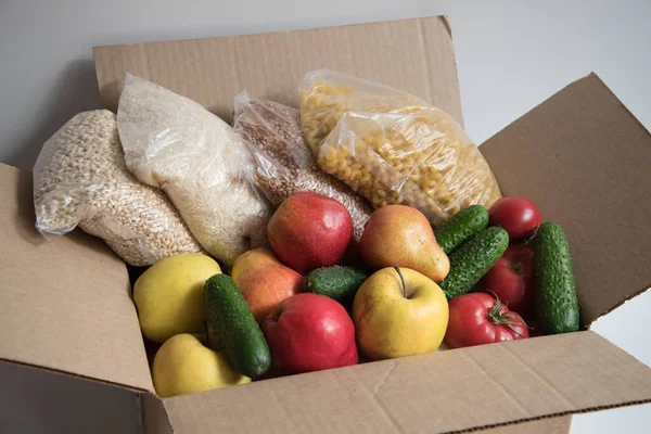 Donation box with food. In a box of cereals and fruits.