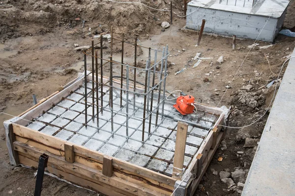 Concrete is poured into the formwork with rebar. Close-up
