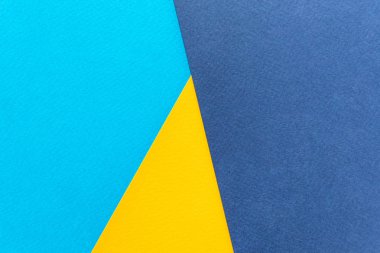 Kağıt sarısı ve mavi. Arkaplan resmi. Minimalizm, düz yatak, metin için yer.