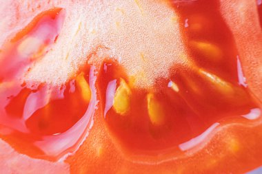 The pulp of a tomato close-up, macro photo. Organic natural food concept. Fresh ripe tomato.