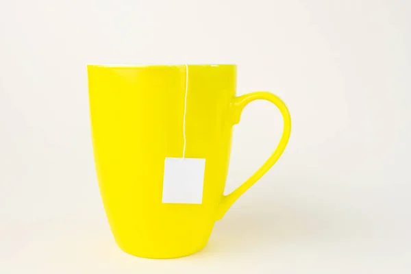 Tasse Jaune Avec Sachet Thé Une Étiquette Blanche Sort Tasse — Photo