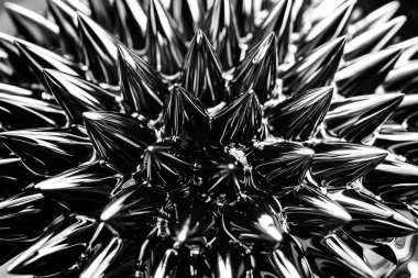 Ferrofluid, manyetik sıvı yakın çekim. Soyut minimalist siyah moda arka planı. Manyetik alanın varlığında akışkan yüksek derecede kutuplaşmış. Etkileyici, şık, yanardöner siyah dikenler..