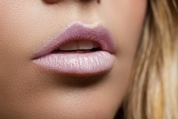 Ajar female mouth closeup. Delicate pink lips. Perfect skin. Pearl lipstick — Stock Photo, Image