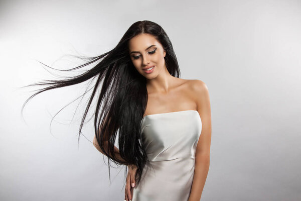 Beautiful girl model with flying the wind hair.