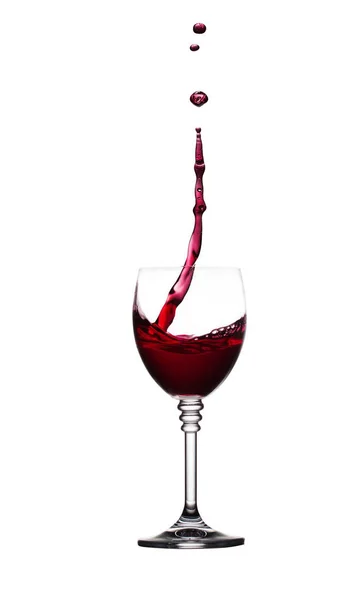 Glass of splashing red wine isolated on white — Stock Photo, Image
