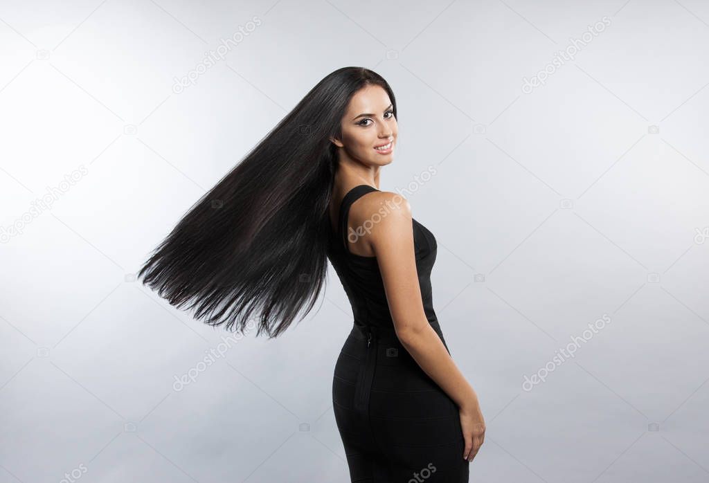 Beautiful girl model with flying the wind hair.