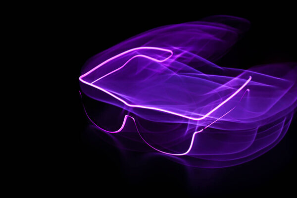 Luminous neon lines. the virtual reality. glasses. black background, motion effect