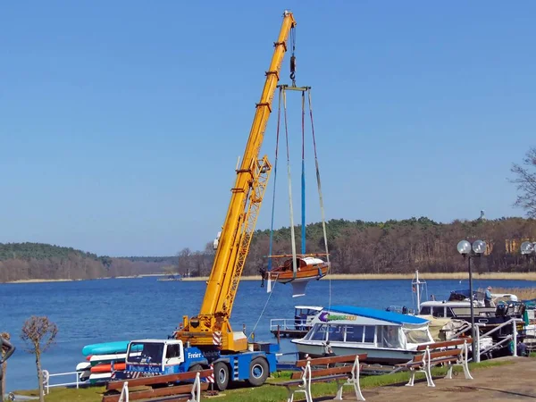 Boats are launched by crane