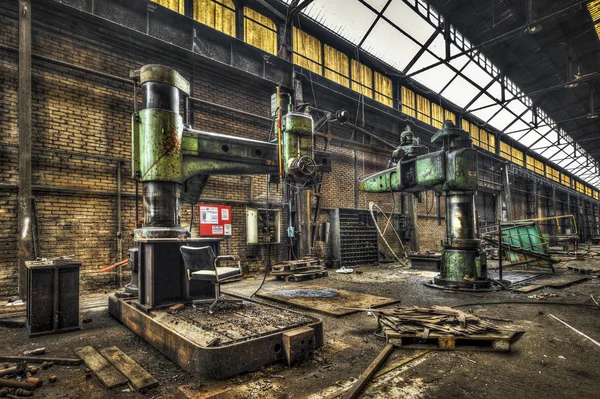 Huge radial drills in an abandoned factory — Stock Photo, Image