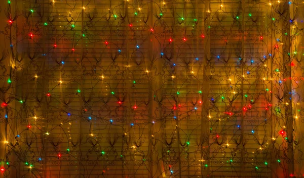 Abstract background of luminous garlands in the New Year's store window. — Stock Photo, Image