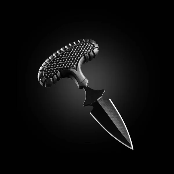 Beautiful shining knife on a black background. — Stock Photo, Image