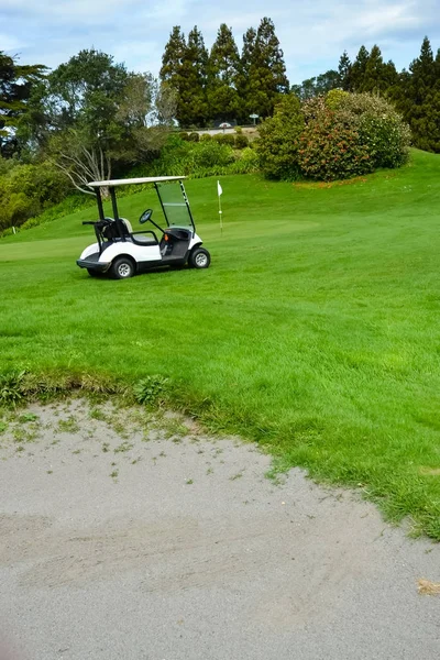 New Zealand Golf Course with sand pit and Golfers Kart Royalty Free Stock Photos