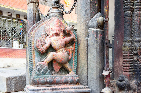 Stone idol of Bali chakravarthi outside the main temple of Bagh Bhairav, considered as a demon in the Hindu mythology.