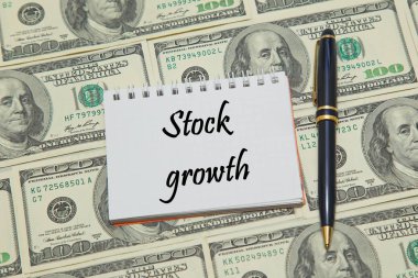 Doları arka plan üzerinde metin hisse senedi büyüme ile defter sayfası
