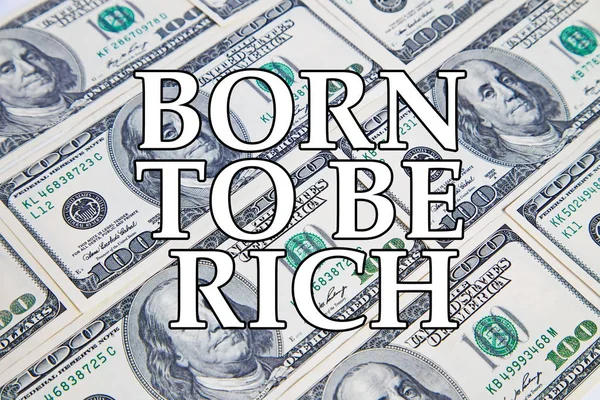 Dollar background with message BORN TO BE RICH