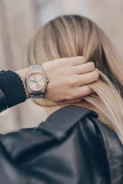 Stylish silver watch on woman hand