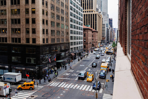 52nd Street and Madson Avenue street view with traffice Midtown Manhattan, New York, USA