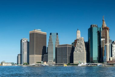 New York City / USA - JUN 25 2018: Lower Manhattan skyline at early morning clipart