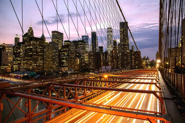 New York City / USA - Jul 10 2018: lower Manhattan view from Brooklyn Bridge at sunsunset — 스톡 사진