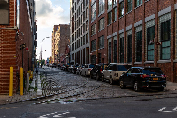 New York City / USA - JUN 25 2018: Quiet street in Dumbo Brooklyn at early morning sunrise