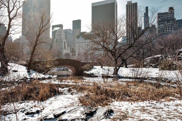 New York City - USA - Feb 21 2019: Gapstow Bridge of Central Park with snow in winter