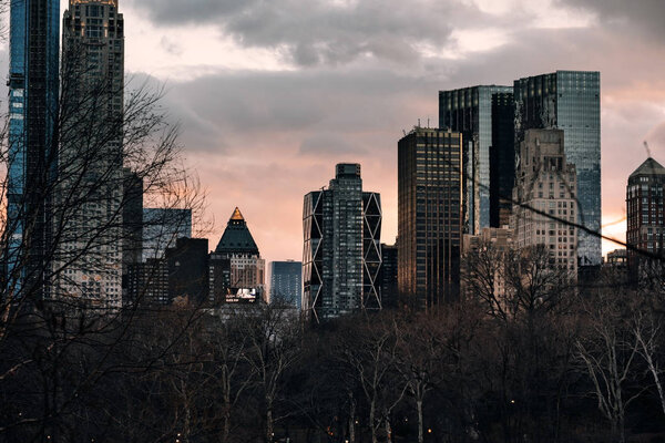New York City - USA - Mar 18 2019: Sunset view of morden skyscrapers in Central Park south midtown Manhattan