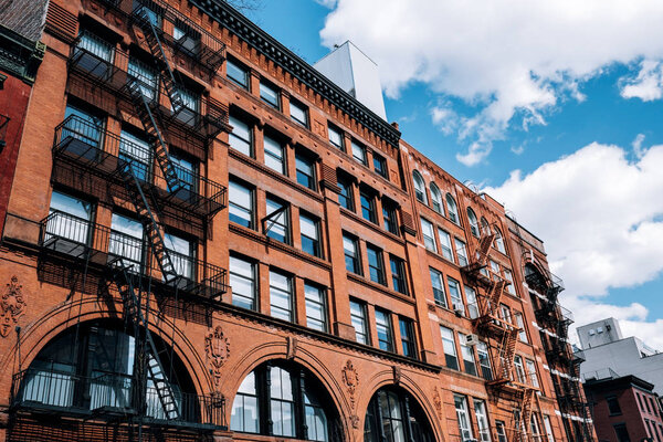 New York City - USA - Mar 19 2019: Typical brick buildings of Chinatown with sings in Lower Manhattan