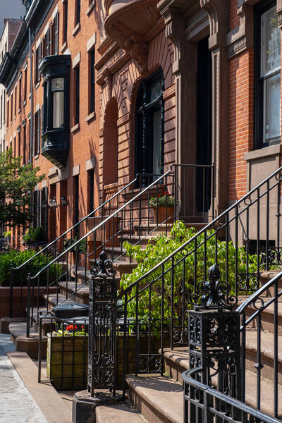 Brooklyn NY - USA - Jul 9 2019: Street scene and apartment buildings of Brooklyn Heights in summer sunny daylight