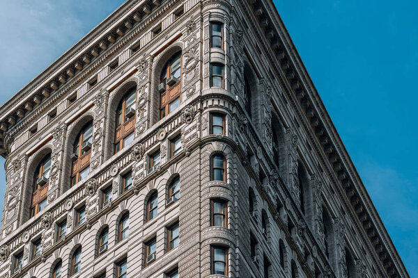 New York City - USA - Mar 14 2019: The Flatiron Building, originally the Fuller Building, is a steel-framed landmarked building located at 175 Fifth Avenue in the Flatiron District neighborhood of borough of Manhattan, New York City.