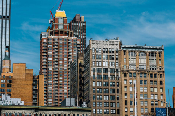 New York City - USA - Mar 14 2019: General view of apartment buildings of Madison Square North from Madison Square park in Flatiron neighborhood New York City