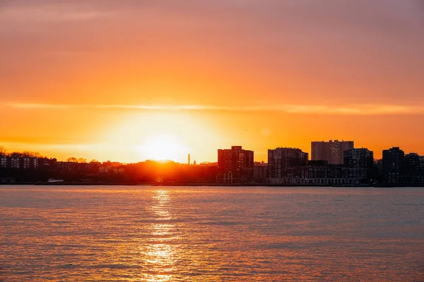 Sunset view of Jersey skyline from Pier 64 in Chelsea New York City