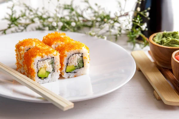 Japanese cuisine california maki sushi on white plate — Stock Photo, Image