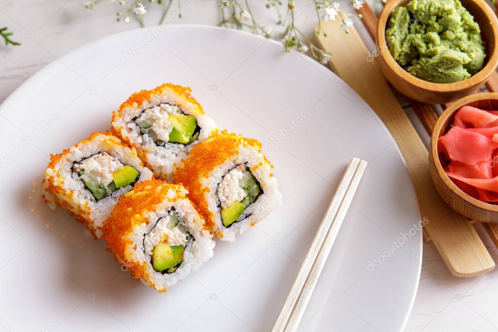 japanese cuisine california maki sushi on white plate
