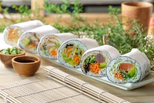 Japanese sushi burrito roll served with wasabi — Stock Photo, Image