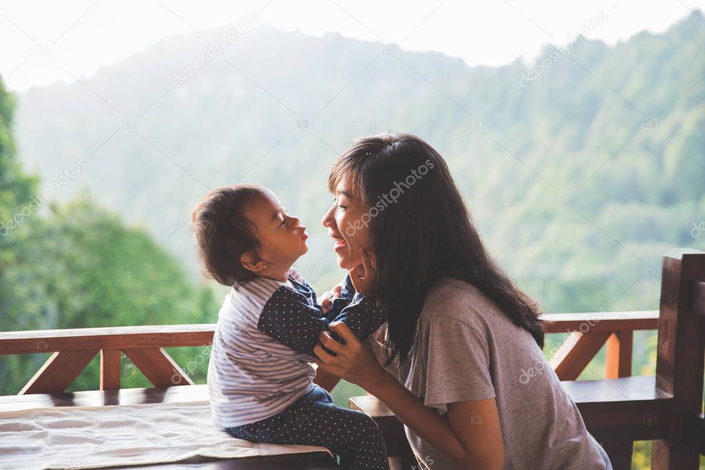 mother playing with daughter