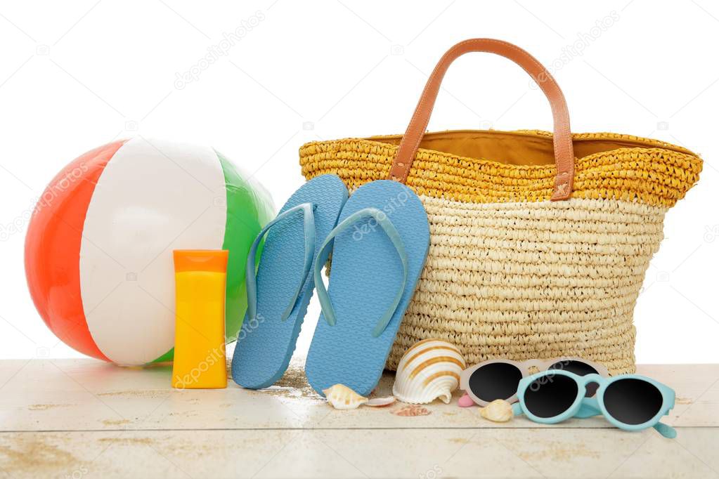 beach accessories on the white wooden table