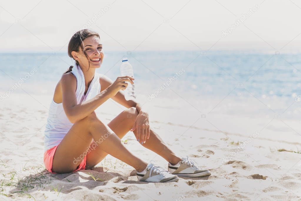 healthy woman taking a rest after workout