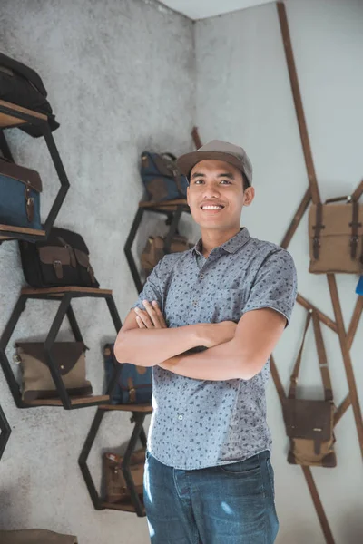 Asian male business owner in a bag shop — Stock Photo, Image