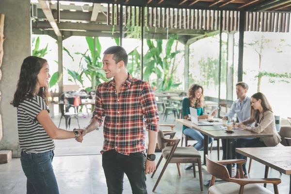 Creative team shake hand in cafe — Stock Photo, Image