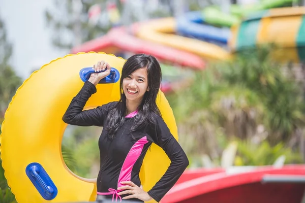 Excited woman with swimming circle — Stock Photo, Image